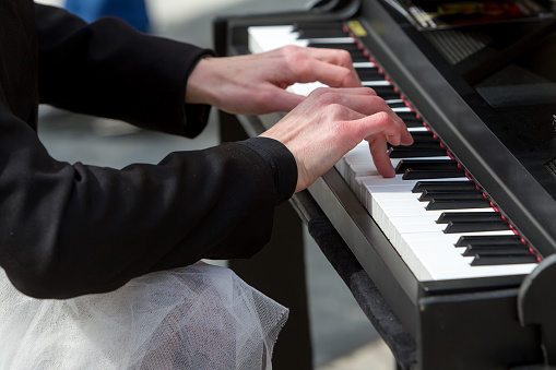 Young lady playing electric piano
