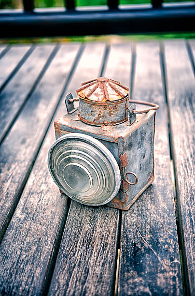 istock Vintage torch on old wood floor texture 494560795