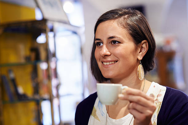 istock People in bar with woman drinking espresso coffee 494561045