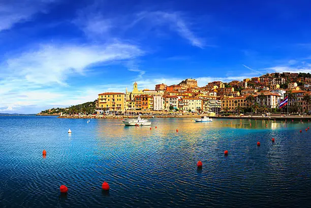 Porto Santo Stefano harbor seafront and village skyline, italian travel destination. Monte Argentario, Tuscany, Italy.
