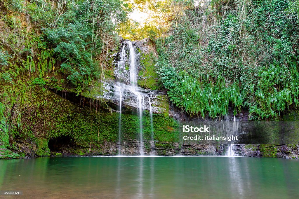 Waterfall in the forest. Waterfall in Nosy-Be with cave Madagascar Stock Photo