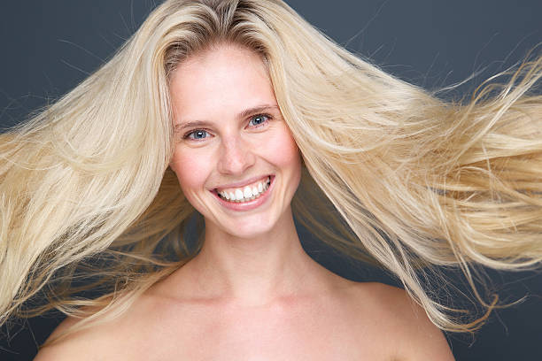istock Young blond woman with beautiful hair 494561379