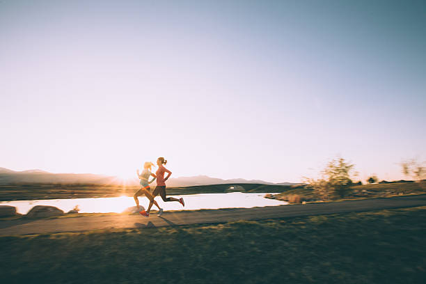 Females Running on Path During Sunset in Utah