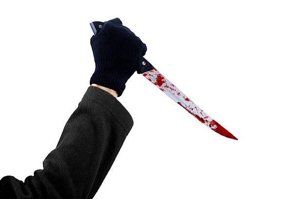 istock Hand holding bloody knife isolated 494563067