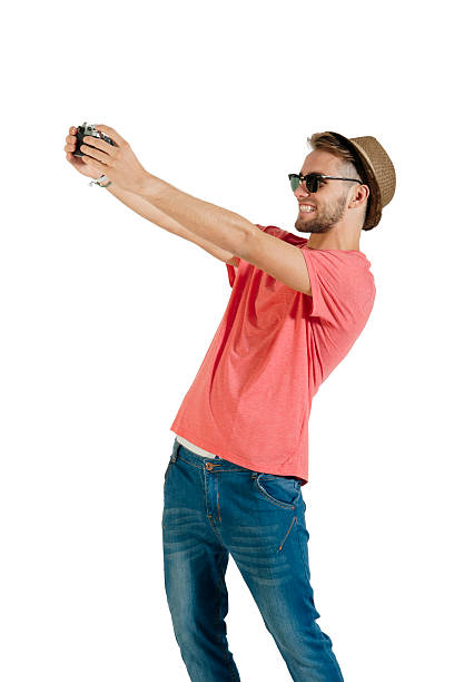 istock young handsome guy taking selfie with film camera 494563115