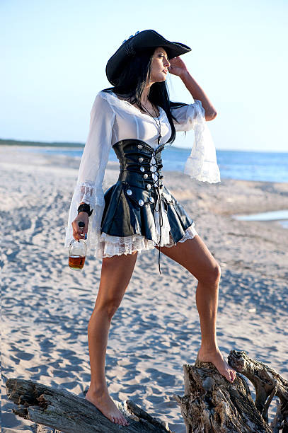 Pirate woman at the beach stock photo