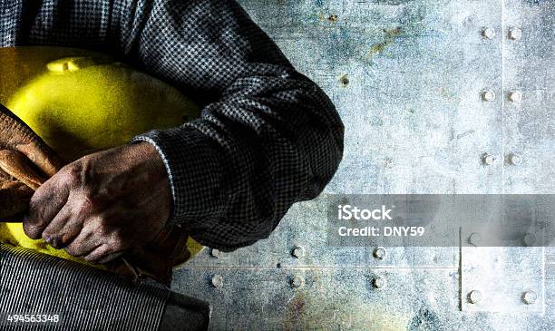 Blue Collar Worker Holding Lunch Pail And Hard Hat Stock Photo - Download Image Now - Construction Worker, Dirty, Holding