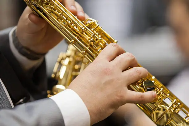 Photo of Saxophone in the hands of a musician