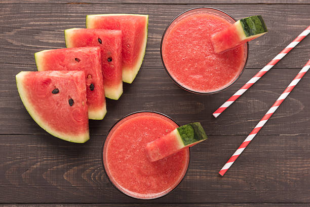 istock Healthy watermelon smoothie on a wood table 494564596