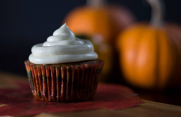 istock One Pumpkin Cupcake with Cream Cheese Frosting 494564680