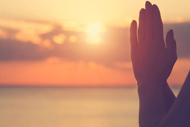 istock Young woman practicing yoga on the beach. 494567658