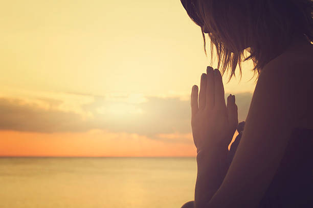 istock Young woman practicing yoga on the beach. 494567692