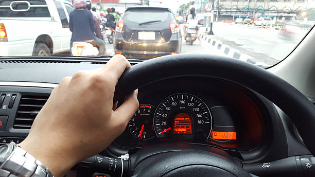 car driving at day,show instrument panel and traffic jam.