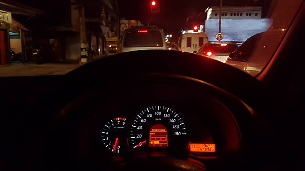 istock car driving at day,show instrument panel and traffic jam. 494568338
