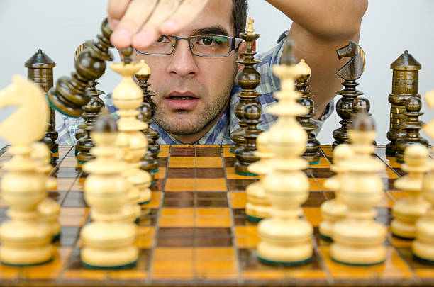 istock Businessman's head can be seen through figures chess 494569568