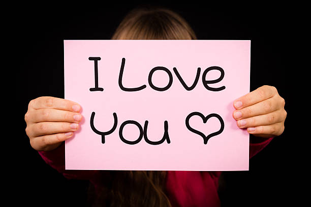 istock Child holding I Love You sign 494572200