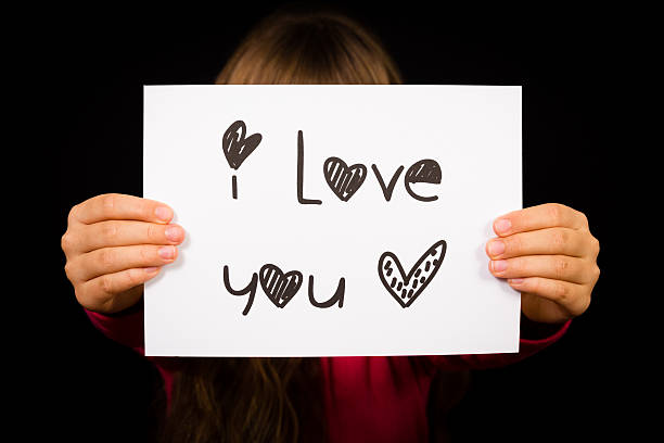istock Child holding I Love You sign 494572220