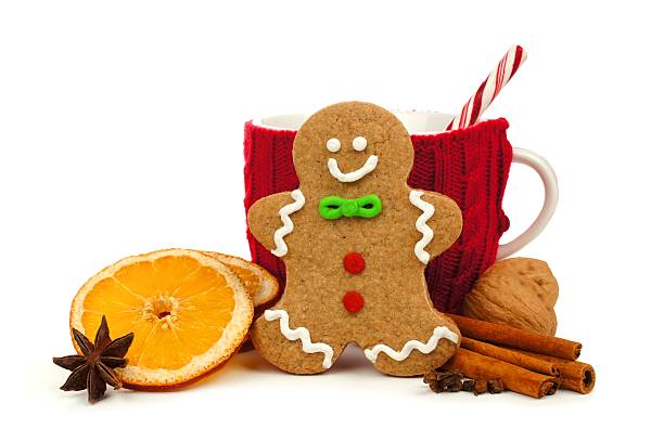 istock Christmas gingerbread man with mug and holiday spices over white 494573450
