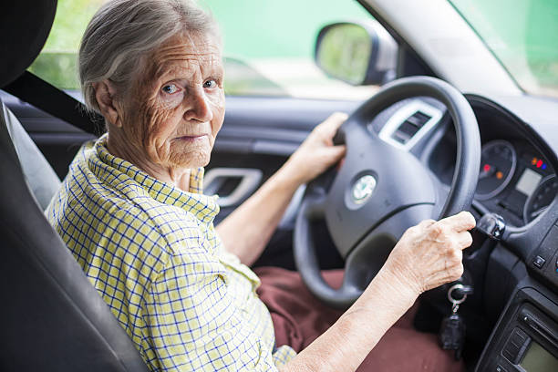 istock Senior woman driving a car 494581014