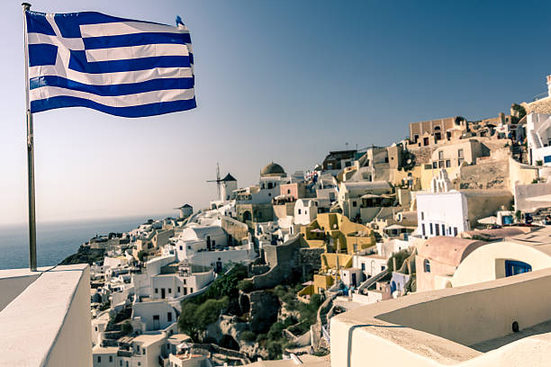 istock Greek flag in Oia town - Santorini 494581876