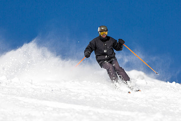 istock Skier skiing on ski slope 494582662