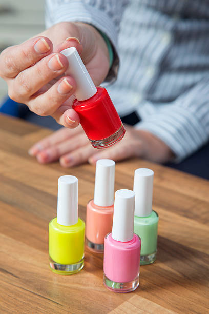 istock Unrecognizable woman holding red nail polish. 494583028