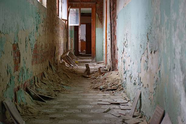istock Urban decay series. Abandoned plant building interior - corridor 494583158