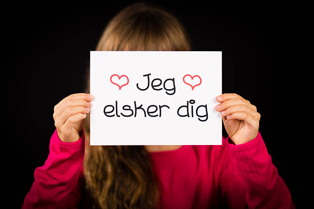 istock Child holding sign with Danish words Jeg Elsker Dig 494583506