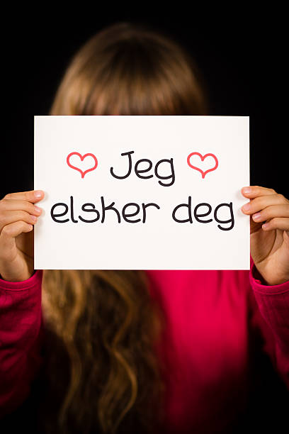 istock Child holding sign with Norwegian words Jeg Elsker Dig 494583652
