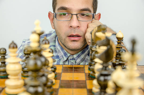 istock businessman is looking and thinking about the move 494584010