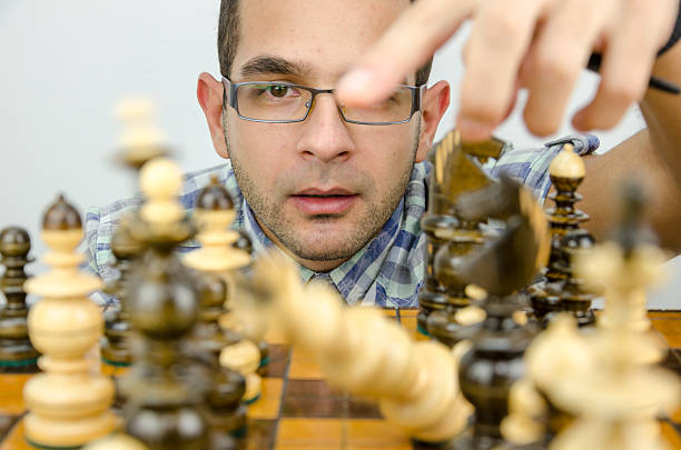 istock businessman is looking and thinking about the move 494584994