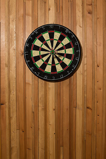 istock The darts isolated on wooden background 494585196