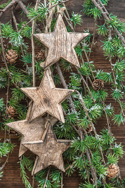 istock Christmas decoration wooden stars and pine tree branches 494585844