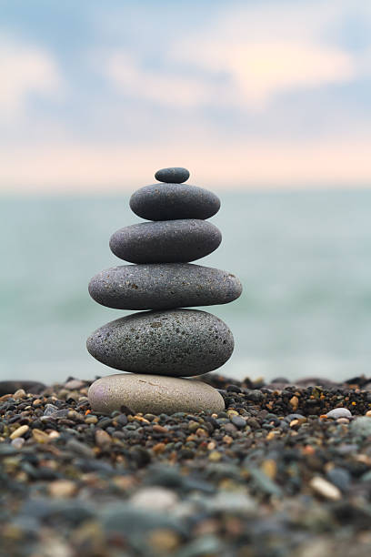 istock Stupa made of sea pebble on a seashore. 494586654