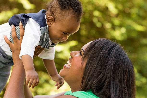 istock African American mother holding her son. 494587640