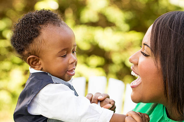istock African American mother holding her son. 494587696