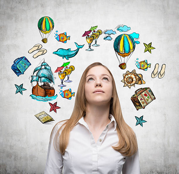 istock woman is looking up by dreaming about vacation 494588198
