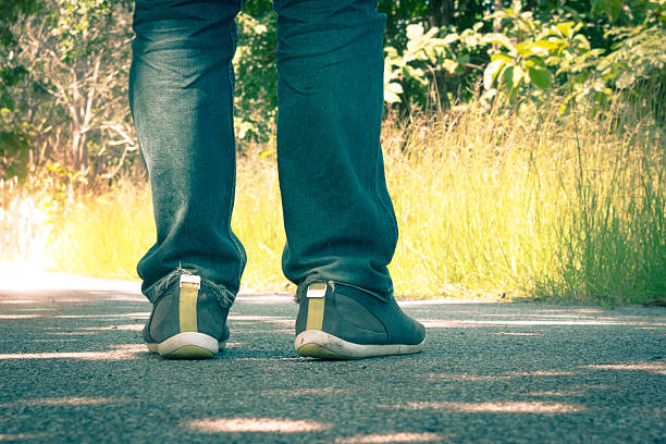 istock Man wearing jeans walking on the unknown street. 494588512