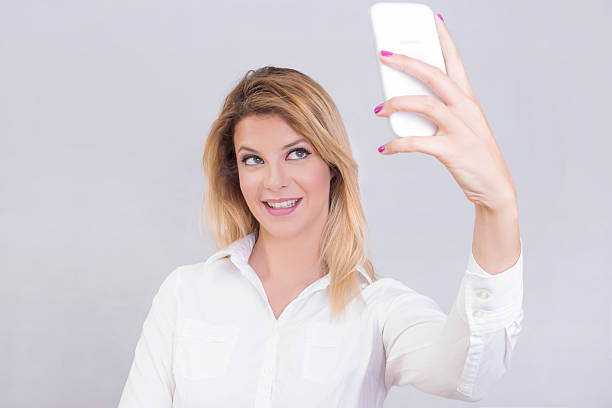 istock Blonde woman selfie 494590382