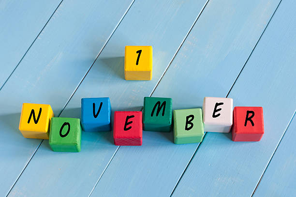 istock First November 1st sign on color wooden cubes with light 494591086
