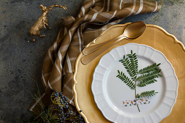 istock Holiday Gold place setting, napkin brown plaid, on grunge backgr 494591106