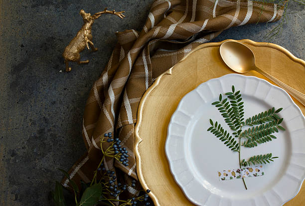 istock Holiday Gold place setting, napkin brown plaid, on grunge backgr 494591250