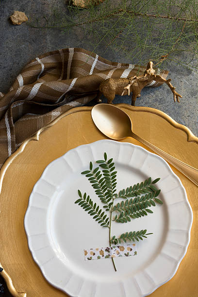 istock Holiday Gold place setting, napkin brown plaid, on grunge backgr 494591372