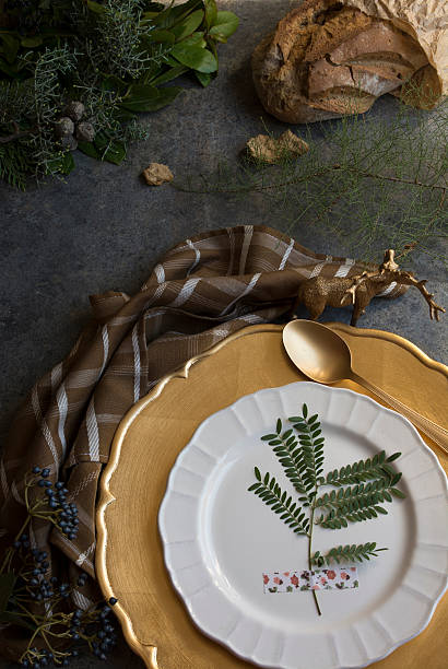istock Holiday Gold place setting, napkin brown plaid, on grunge backgr 494591502