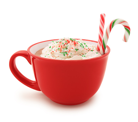 Christmas Hot Chocolate with whipped cream, sprinkles and candy canes isolated on white (excluding the shadow)