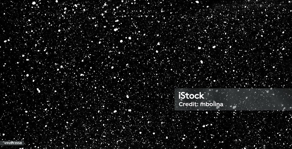 Chute de neige sur fond noir - Photo de Fond noir libre de droits