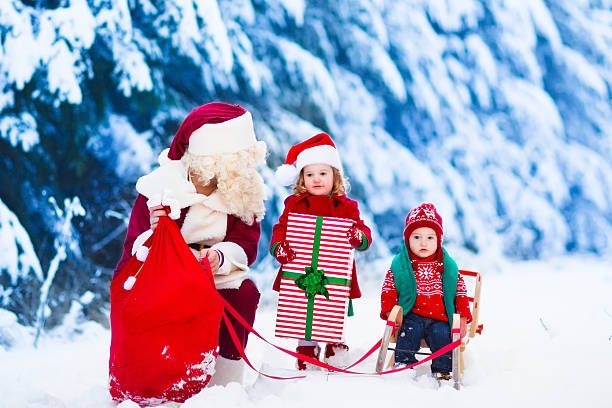 istock Kids and Santa with Christmas presents 494594560