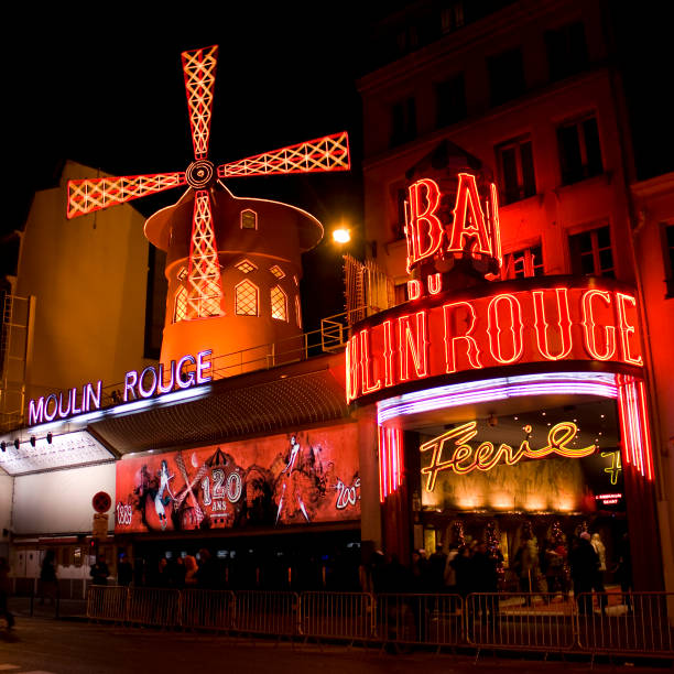 Paris, France - October 2, 2012: The Moulin Rouge by night, on October 2, 2012 in Paris, France. Moulin Rouge is a famous cabaret built in 1889, locating in the Paris red-light district of Pigalle