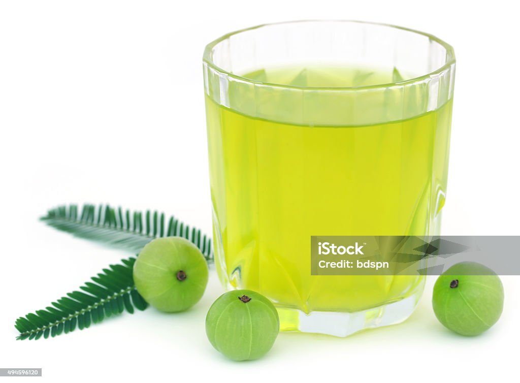 Herbal amla juice with fresh fruits Herbal amla juice with fresh fruits over white background Juice - Drink Stock Photo