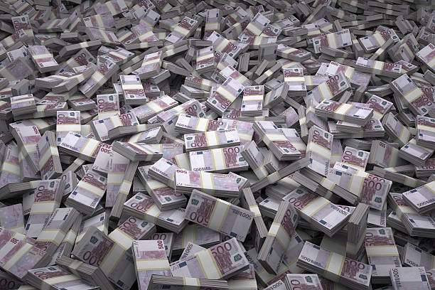 Money Pile Bundles of €500 Euro Notes Bundles of €500 Euro bills scattered randomly. Billions of Euros worth of money spread over the ground and viewed from above. A sea of money and great background. billion stock pictures, royalty-free photos & images